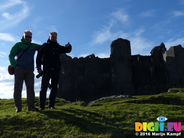 FZ025994 Marijn and Pepijn leaning against Carreg Cennen Castle